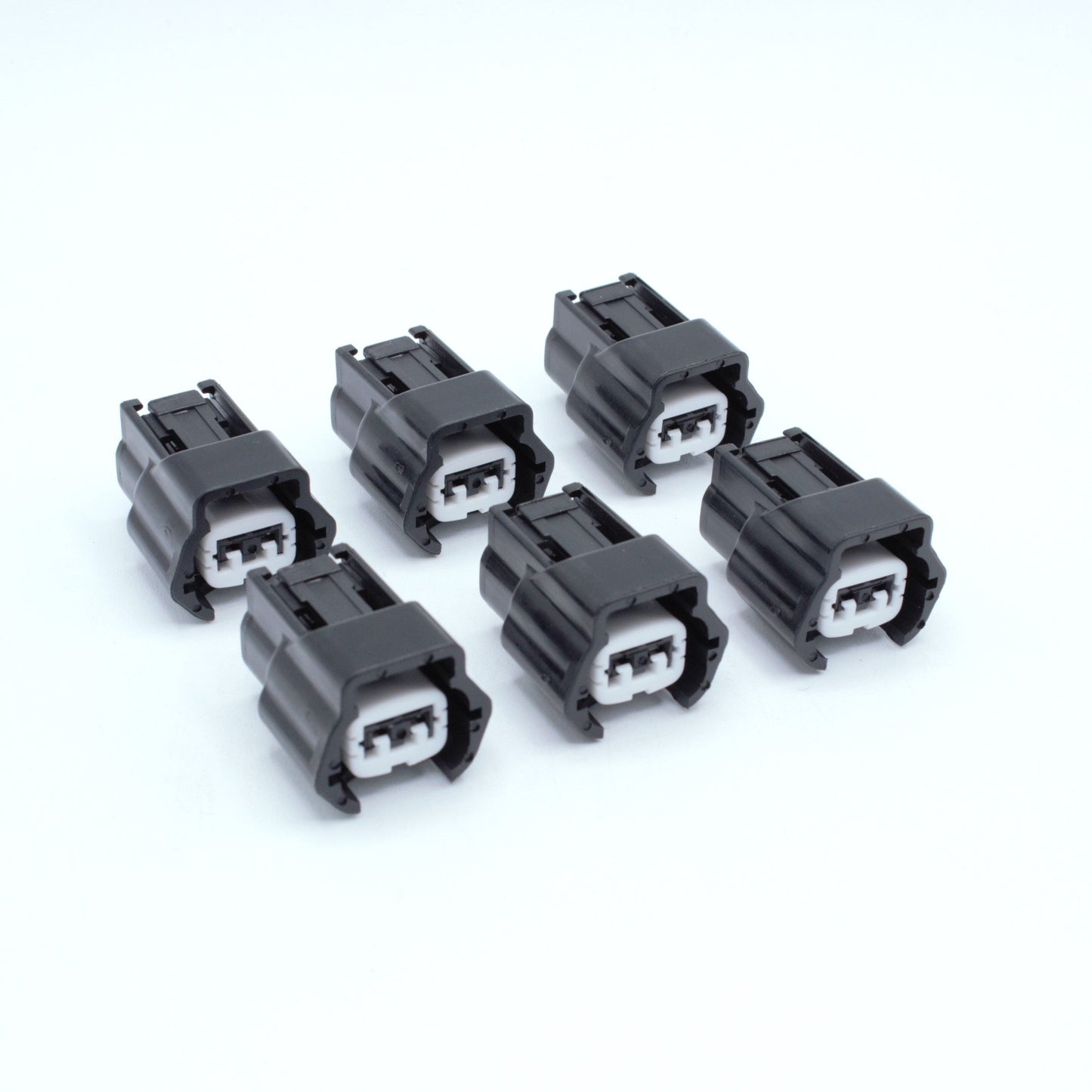 Set of 6 Nissan injector connector for RB and SR engines
Black with a white TPA 
left side low key right side high key
comes with terminals and seals
Made by Sumiomo RS type E series 2 pin way terminal, sealed
sold as a set of 4 or 6