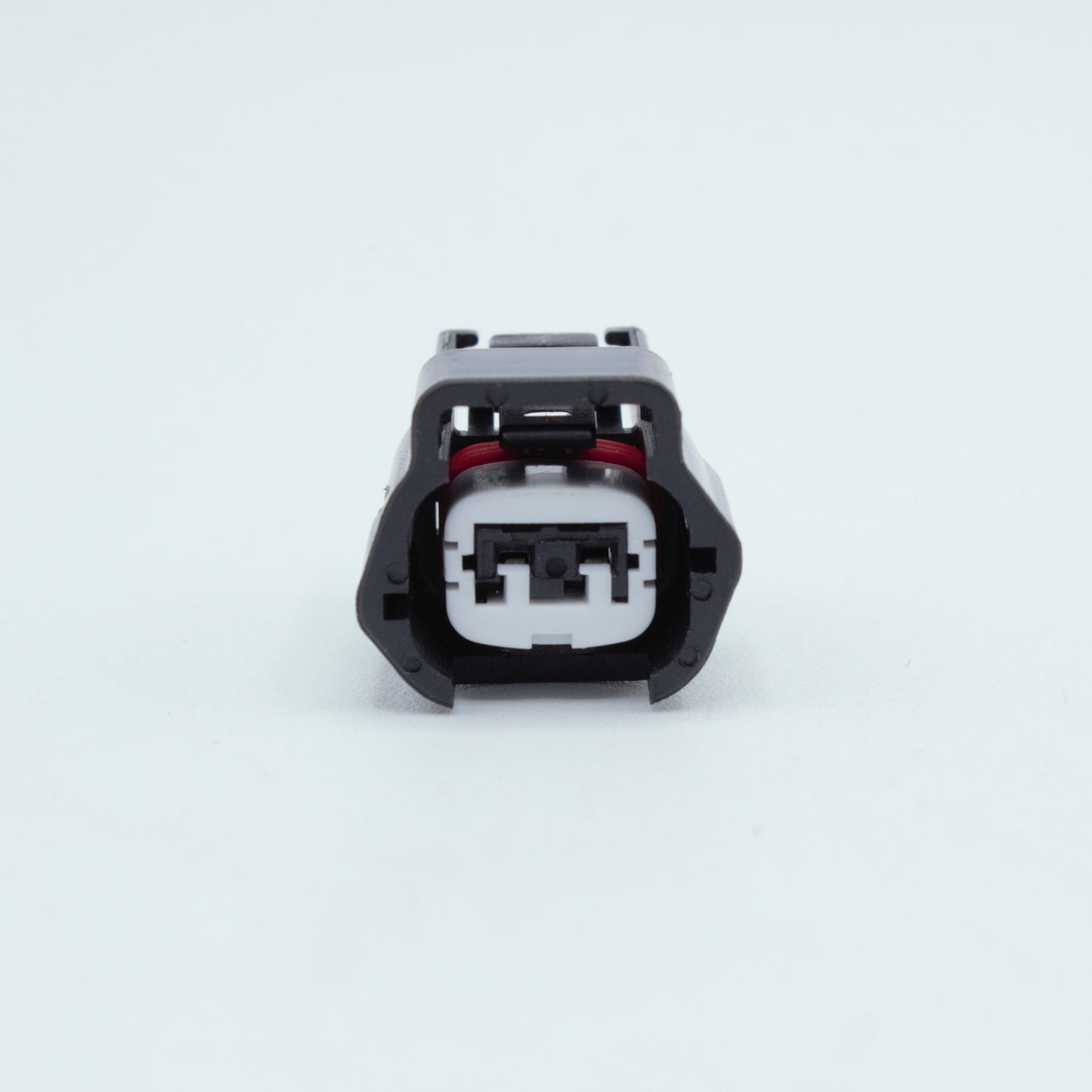 Nissan injector connector for RB and SR engines
Black with a white TPA 
left side low key right side high key
comes with terminals and seals 2 pin way terminal, sealed
Made by Sumiomo RS type E series
sold as a set of 4 or 6