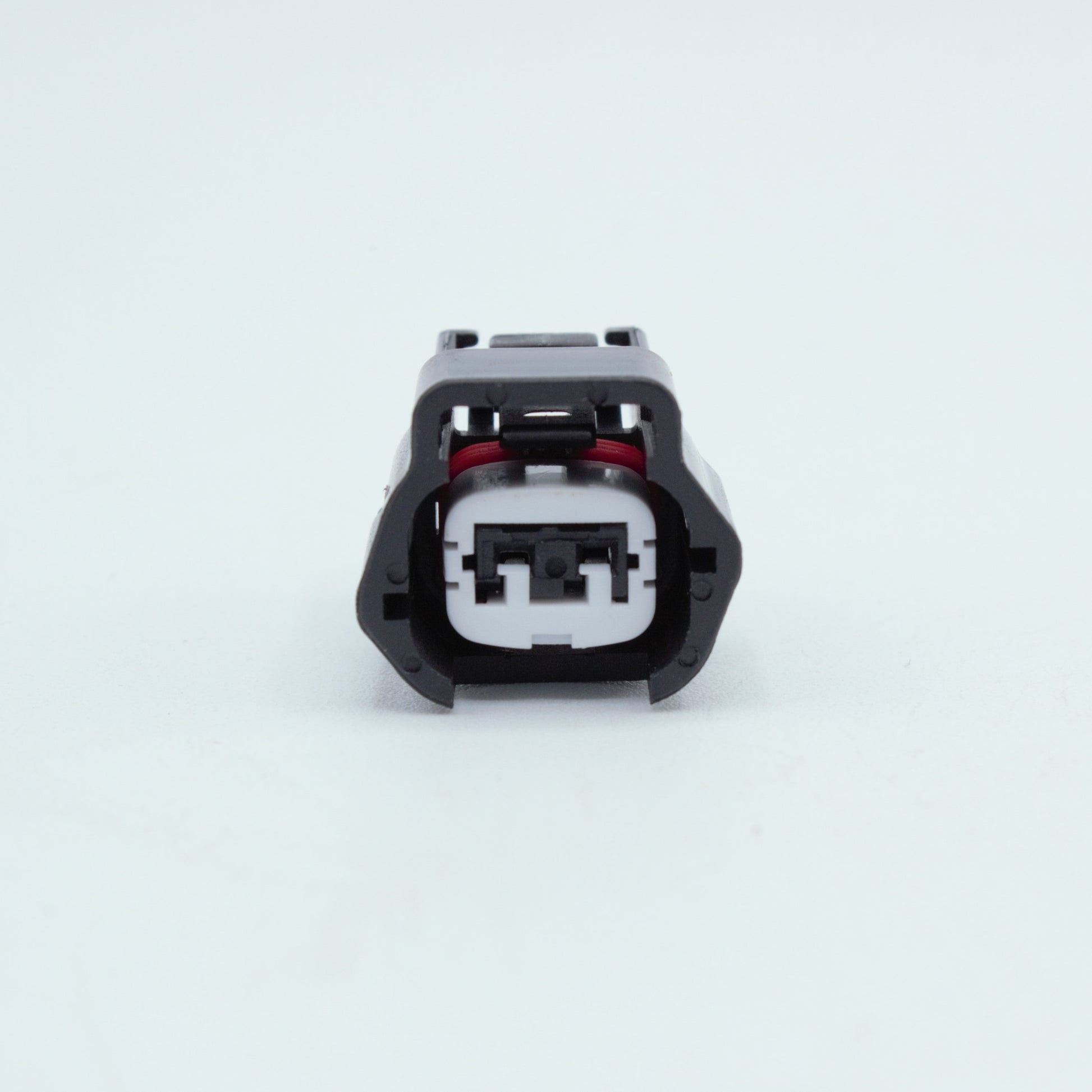 Nissan injector connector for RB and SR engines
Black with a white TPA 
left side low key right side high key
comes with terminals and seals 2 pin way terminal, sealed
Made by Sumiomo RS type E series
sold as a set of 4 or 6