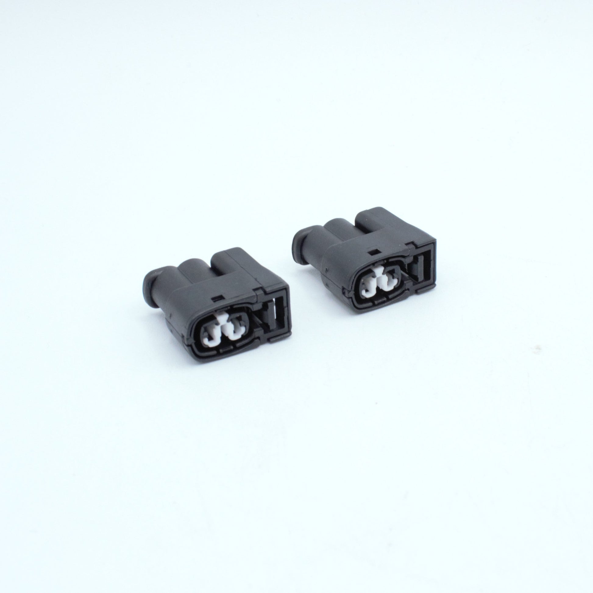 Set of 2 toyota ignition coil connectors
2 pin way terminal, sealed
Black with white TPA in center
Made by Yazaki Sumitomo 090 090II series

commonly used in UZ ignition systems with distributors and 1JZ 2JZ coils as well as 7M and other Toyota engines

sold as a set of 2, 3 or 6, comes with terminals and seals