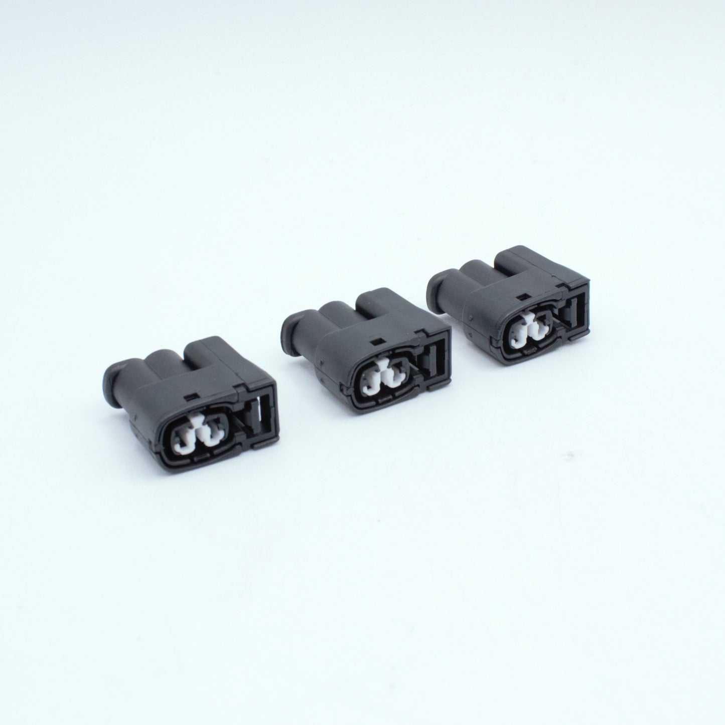 Set of 3 toyota ignition coil connectors
2 pin way terminal, sealed
Black with white TPA in center
Made by Yazaki Sumitomo 090 090II series

commonly used in UZ ignition systems with distributors and 1JZ 2JZ coils as well as 7M and other Toyota engines

sold as a set of 2, 3 or 6, comes with terminals and seals